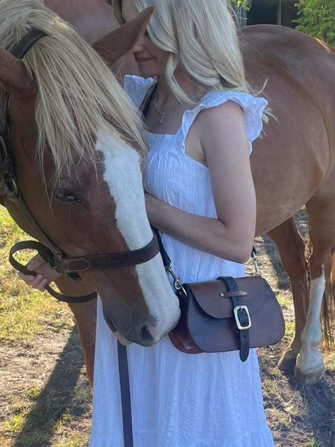 Knight NZ photo 2 Girl in white dress with horse and vintage leather bag