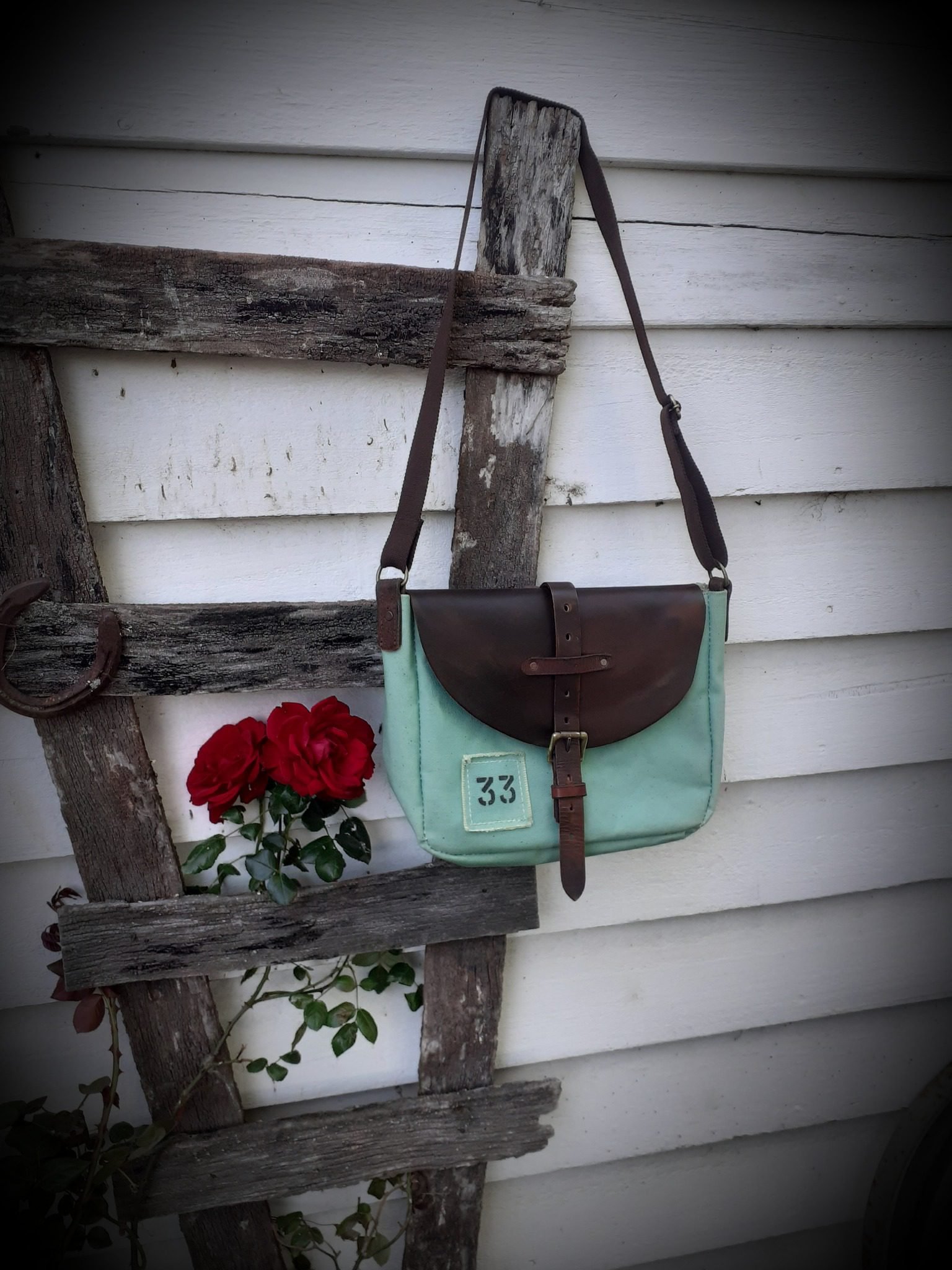 Knight NZ photo 14 Girl-stepping-down-from-vintage-bus-with-white-dress-and-vintage-leather-bag